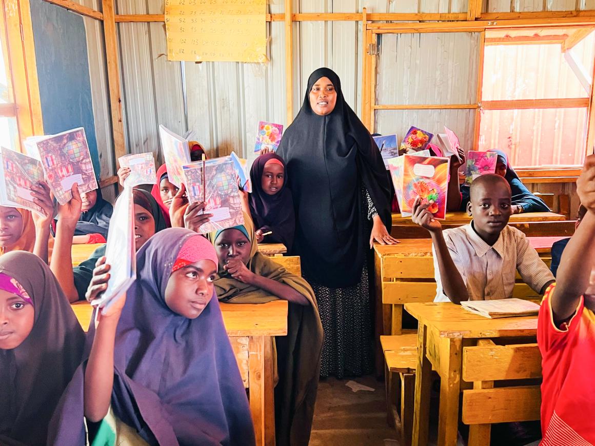 Principal with pupils from marginalised community